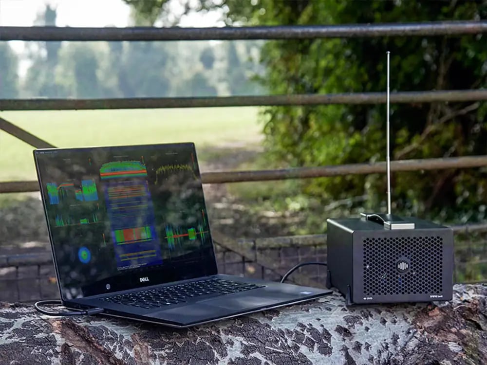 Laptop and portable spectrum monitoring and I/Q data recorder being used to optimize the performance of an RF system