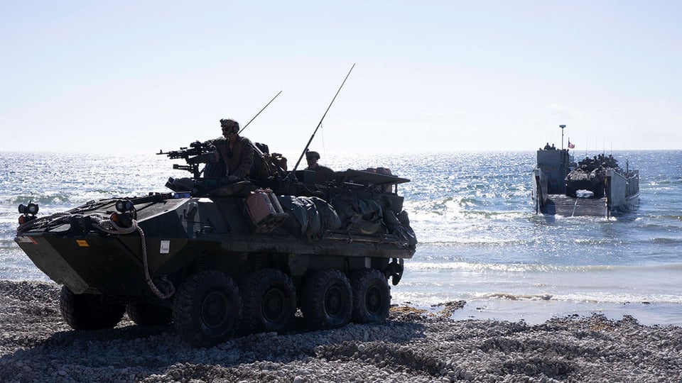 military vehicles on a beach