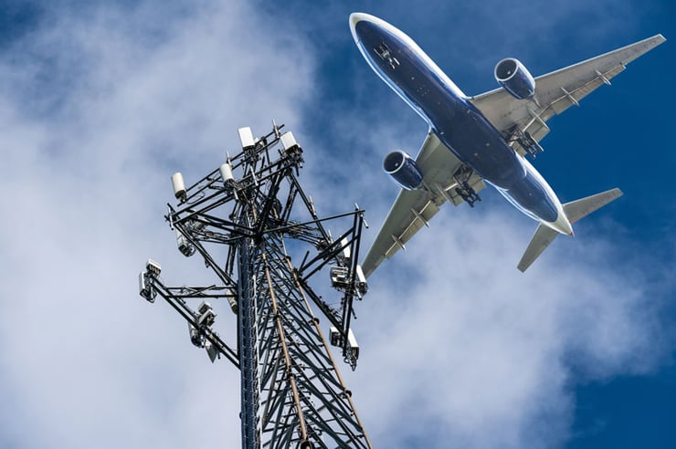 Plane passing over a cell tower